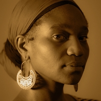 portrait image showing the face of Chotsani Elaine Dean a Black woman in sepia tone